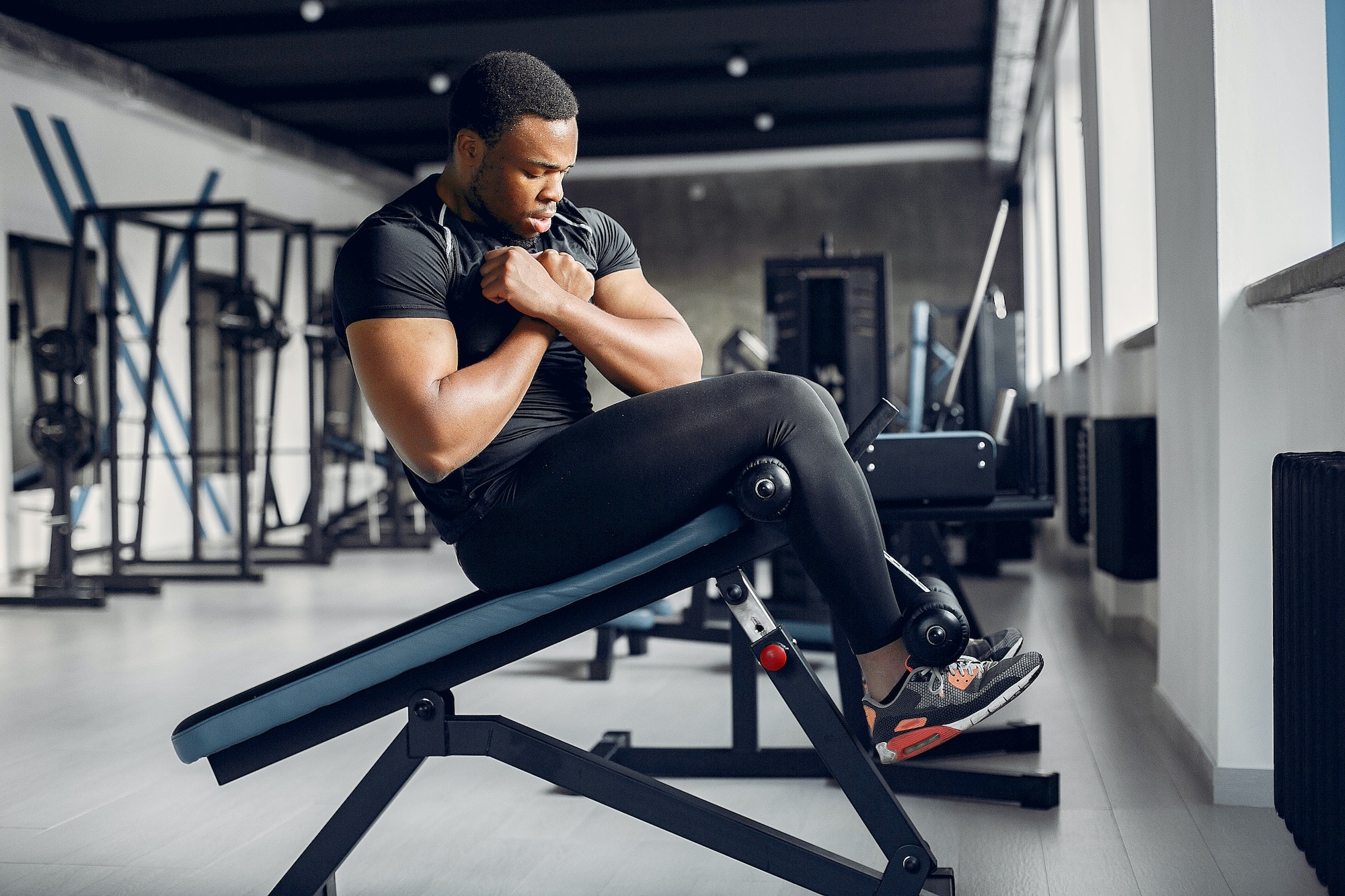 A handsome black man is engaged in a gym